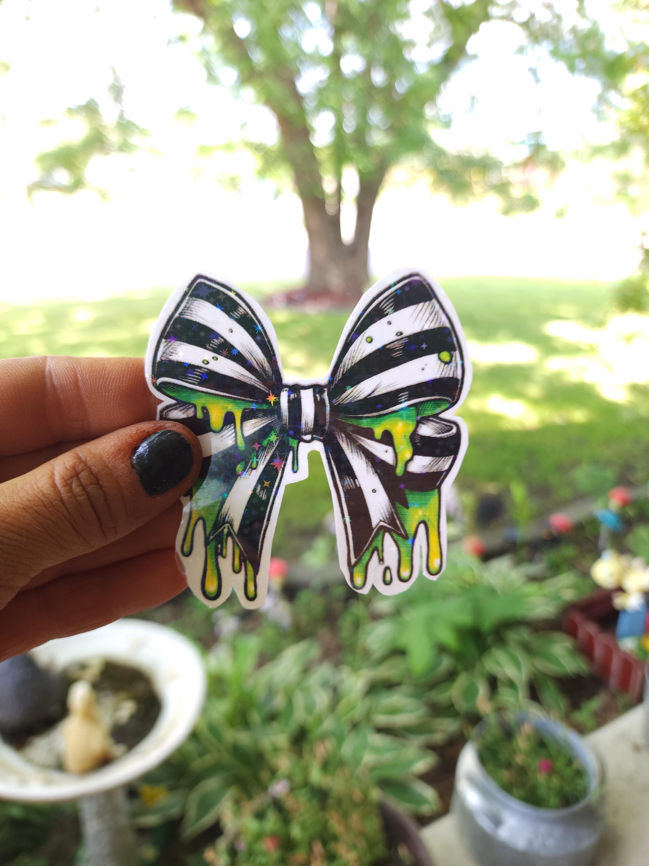 Gothic Bow Vinyl Sticker: Black & White Stripes with Neon Green Slime