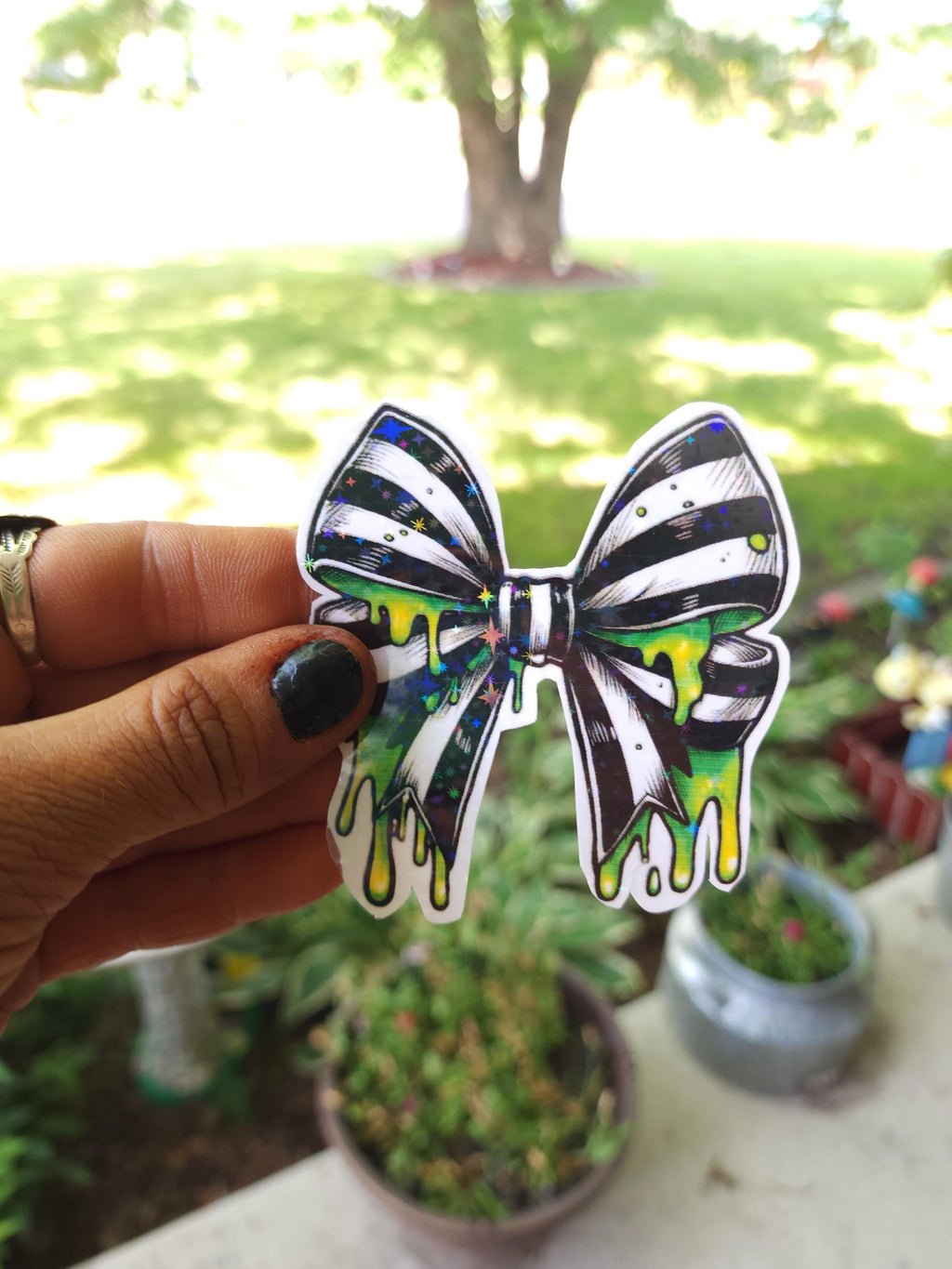 Gothic Bow Vinyl Sticker: Black & White Stripes with Neon Green Slime