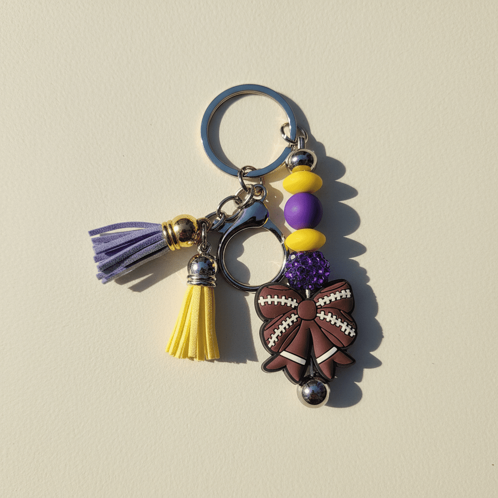 Purple and Gold Handmade Beaded Football Bow Keychain – Sports Bow Keychain, Game Day Team Spirit Accessory - Hempin Mayhem