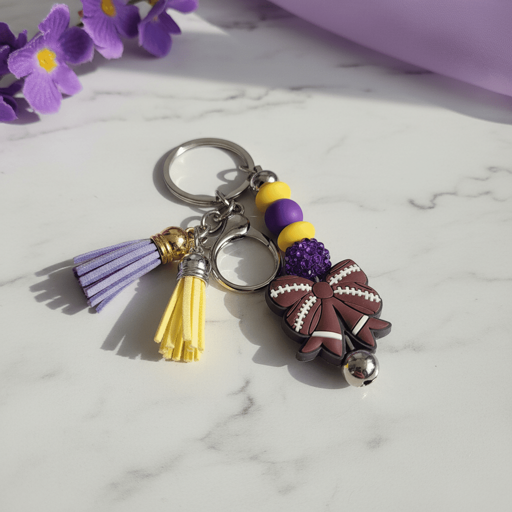 Purple and Gold Handmade Beaded Football Bow Keychain – Sports Bow Keychain, Game Day Team Spirit Accessory - Hempin Mayhem