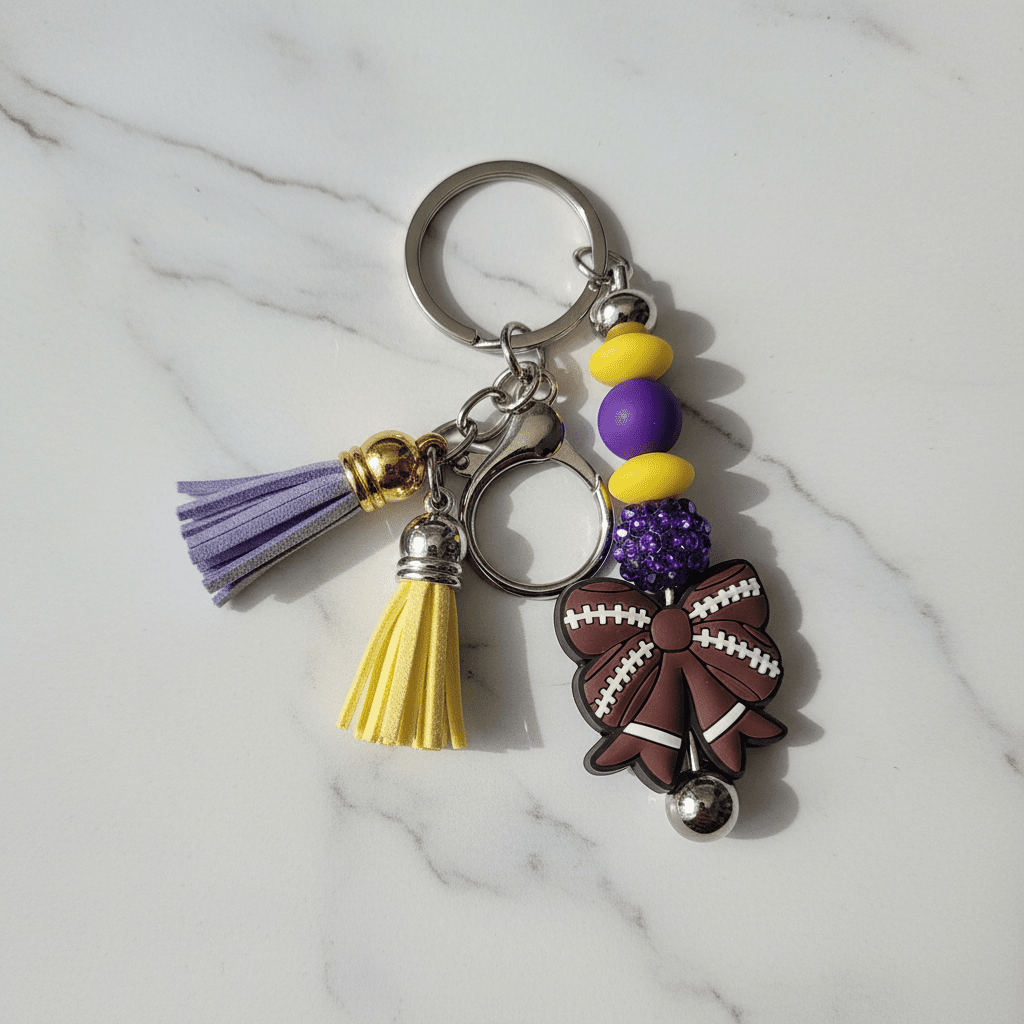 Purple and Gold Handmade Beaded Football Bow Keychain – Sports Bow Keychain, Game Day Team Spirit Accessory - Hempin Mayhem